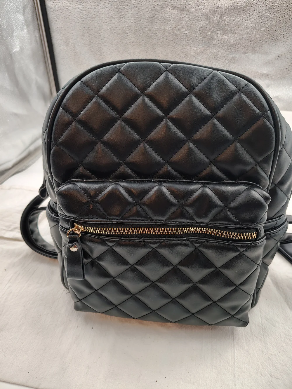 Quilted Black Mini Backpack with Gold Zip Accent
